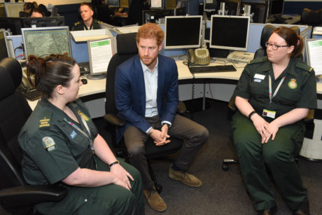 Prince Harry talks to control room staff Alex and Katie about their experiences