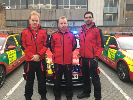 Crew from the Physician Response Unit in front of car