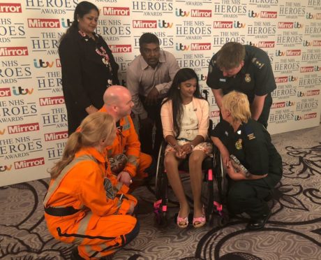 The medics who saved Thusha talk to her and her family at the NHS Heroes Awards