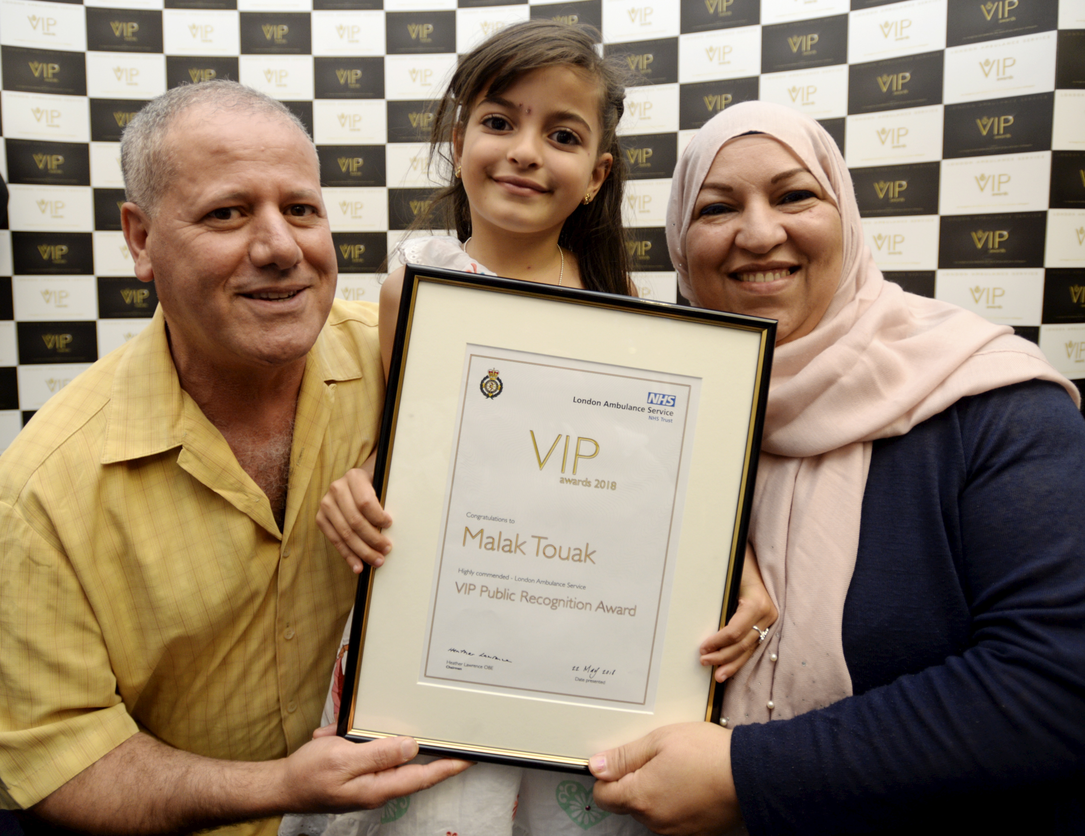 Malak with Jarrod Farrell and her award
