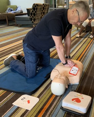 Staurt Anderson demonstrating chest compressions at the session