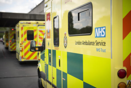 A row of ambulances parked in front of one another