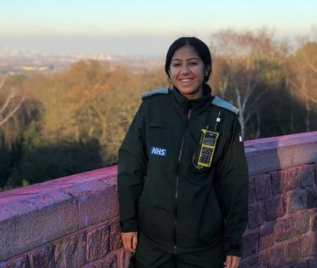 Emergency responder in uniform smiles