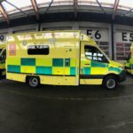 row of new ambulances in garage
