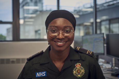 Zeynab in uniform smiling to camera