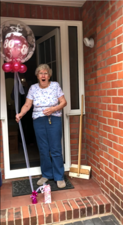 Glennis at her front door looking very surprised