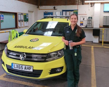 Stephanie stood in front of an ambulance car