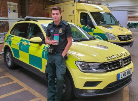 Thomas stood in front of an ambulance car and ambulance