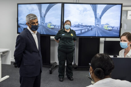 Mayor in training centre stood talking to two call handlers