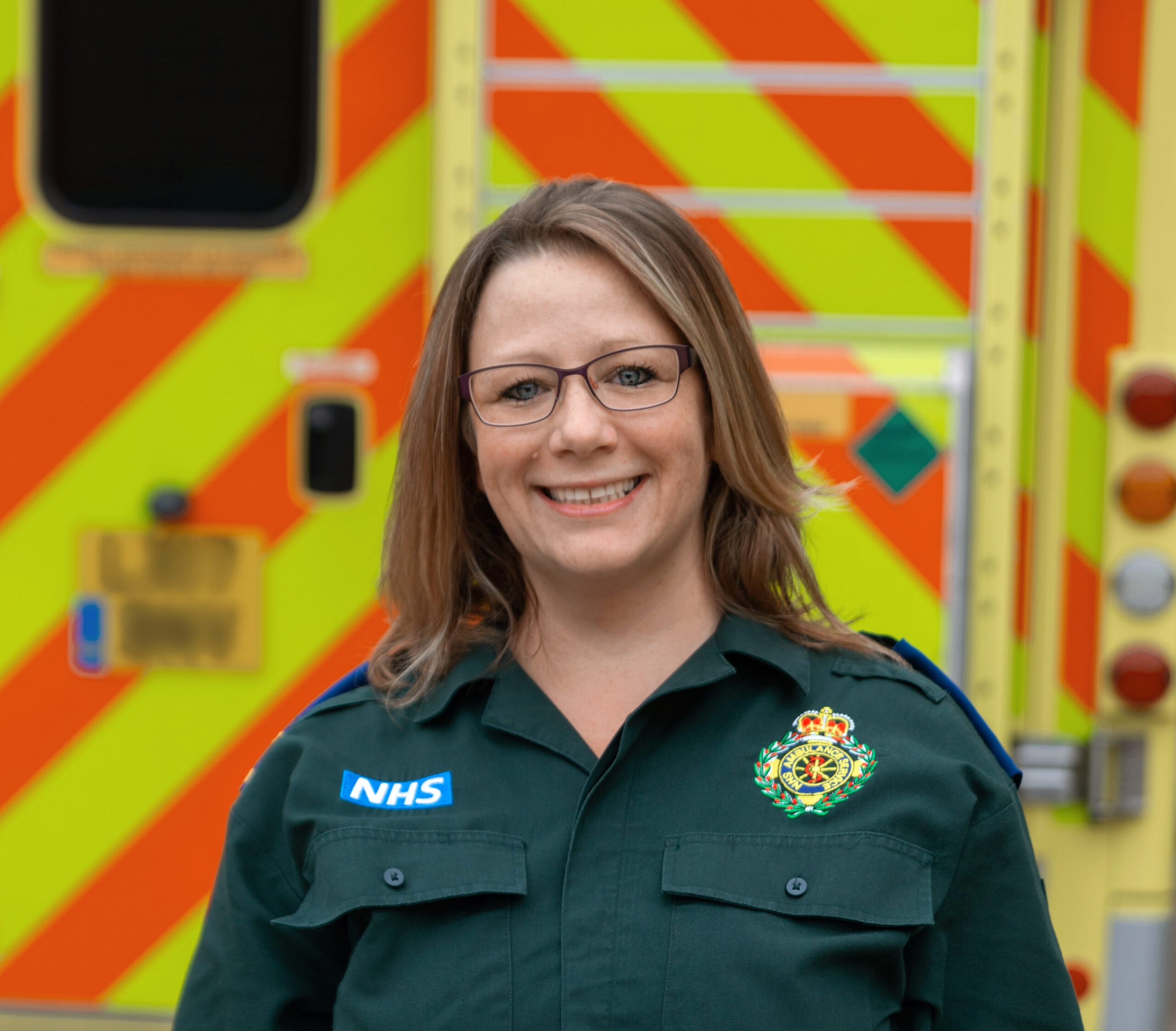 Louise in front of an ambulance