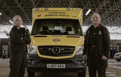 Maisie and Nicola stood in front of an ambulance