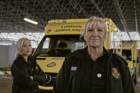 Maisie and Nicola stood in front of an ambulance