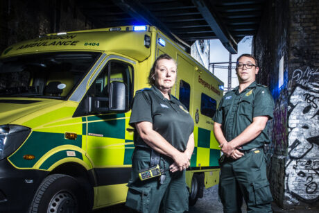 Debbie and Liam stood next to an ambulance