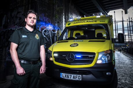 Keith stood next to ambulance under bridge