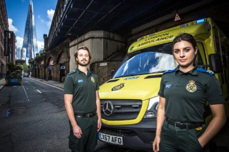 David and Sarah next to an ambulance with The Shard in background