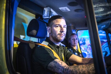 Stuart and Rachel in the cab of an ambulance