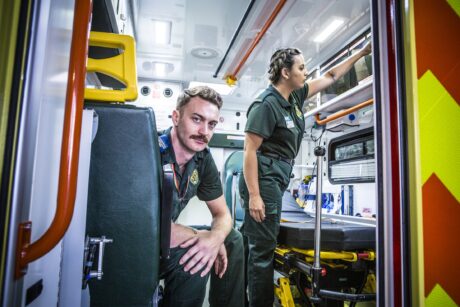 Adam and Orani in back of an ambulance