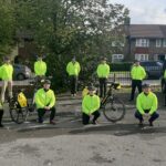 A group of a paramedics in hi vis coats and bicycles