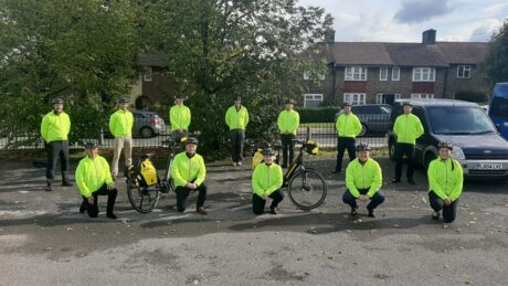 A group of a paramedics in hi vis coats and bicycles