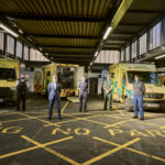 Paramedic, firefighter, Mayor of London, police officer and LAS chief operating officer in front of a row of ambulances