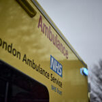 the side of an ambulance with the LAS logo visible