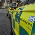 the side door of an ambulance car with the LAS logo visible