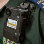 A close up showing Gary's body worn camera attached to his uniform