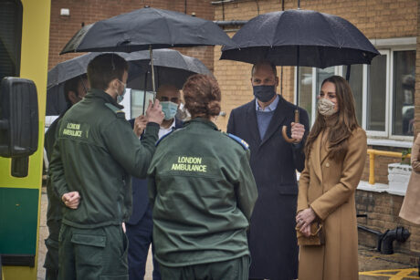 Duke and Duchess stood in conversation with uniformed members of London Ambulance Service