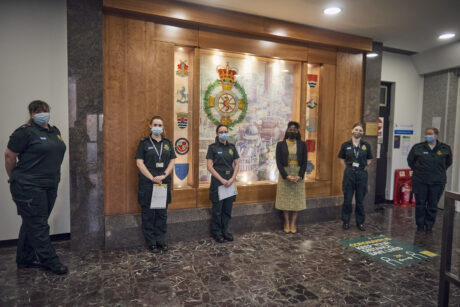 Chief Midwifery Officer posing with ambulance staff after presenting them with certificates