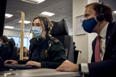 Secretary of State Matt Hancock seated alongside a call handler