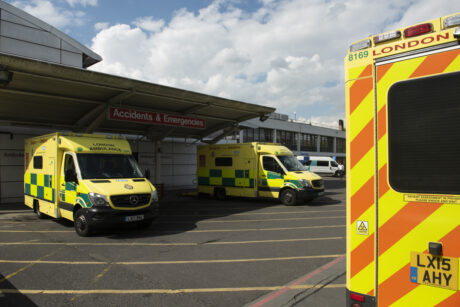 Ambulance parked in a hospital bay in sunny weather