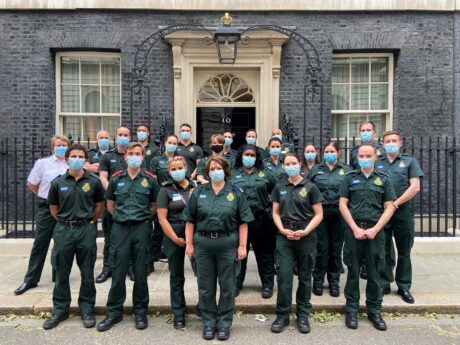 A group of medics in LAS uniform stood outside the door to 10 Downing Street