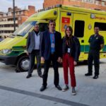 Nicolas, Alaia with medics (L) John, Vijay, Junaid and Kirsty stood in front of an ambulance