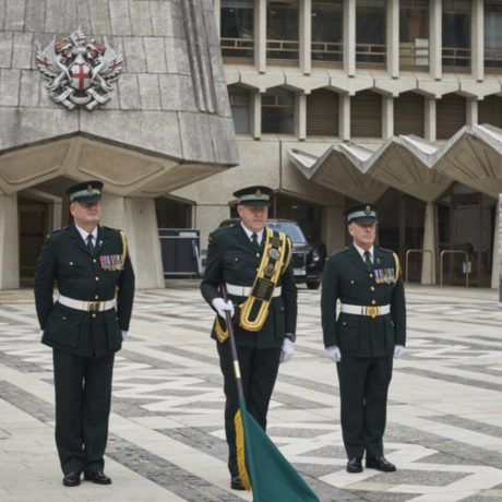 Our Ceremonial Unit in their formal dress at the Guildhall event with a flag lowered