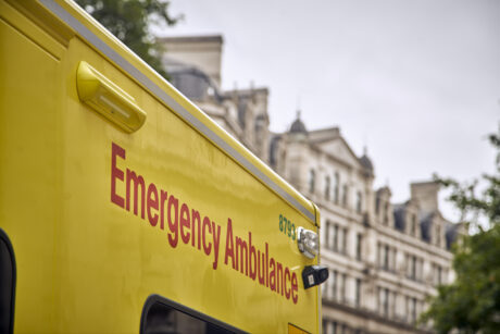 An image showing the side of an ambulance with the words Emergency ambulance visible