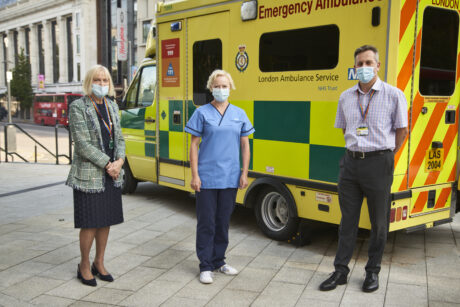 Heather Lawrence, Ruth May and Daniel Elkeles in front of an ambulance
