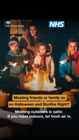 A graphic shows children and adults around a bonfire with sparklers and text overlaid reads: Meeting friends or family on Halloween and Bonfire Night? Meeting outdoors is safer. If you meet indoors, let fresh air in 