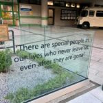 A plaque in the memorial garden which reads “There are special people in our lives who never leave us, even after they are gone.”