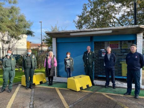 The team at Edmonton ambulance station after observing a two minute silence stood in a line in an ambulance station forecourt