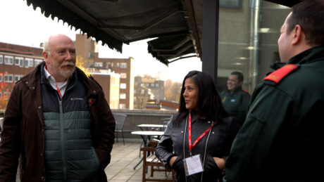 Paul and Sahika speaking to paramedic Nick