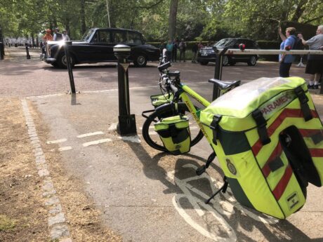 A cycle paramedic's bike on its stand in a London park