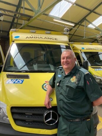 Tom photographed next to an ambulance in a recent picture