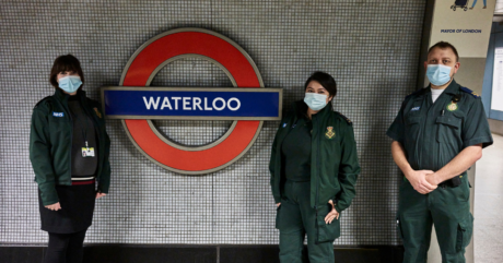 Sophie, Alyssa and David in their LAS uniform photographed next to the Waterloo TfL roundel