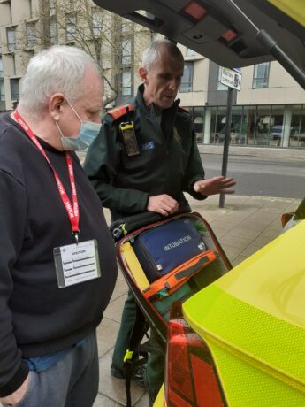 David being shown equipment used in an ambulance car
