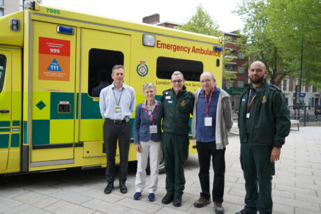 Brian, Sally, Callum, Alex and CEO Daniel pose for a photo in front of a London Ambulance