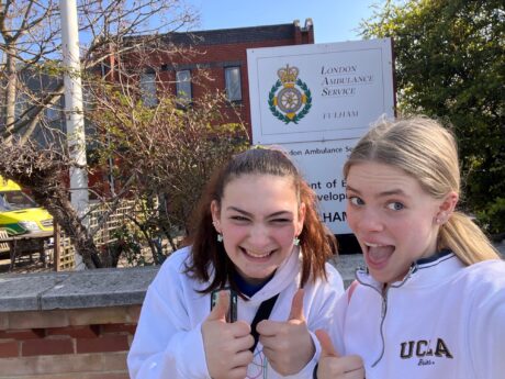 Gemma and Nicole outside Fulham station on their marathon walk