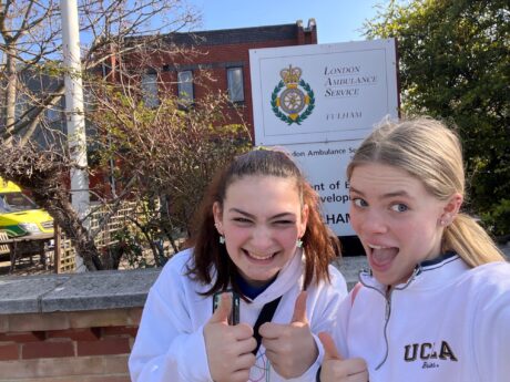 Gemma and Nicole outside Fulham station on their marathon walk