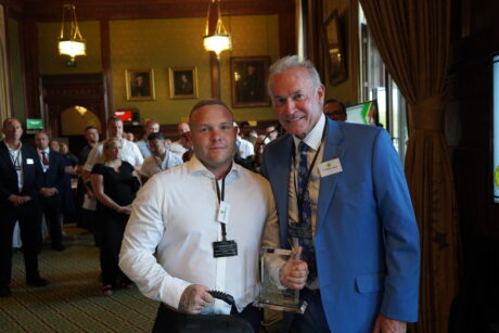 Ashley Bickers with his award and Dr Hilary Jones