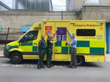 Jubilee livery being placed on a London Ambulance