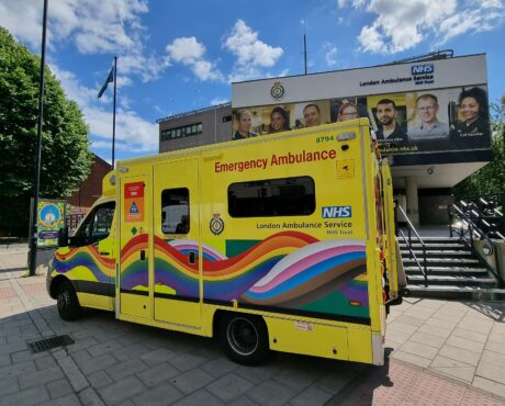 Ambulance with progress flag livery in front of Waterloo HQ